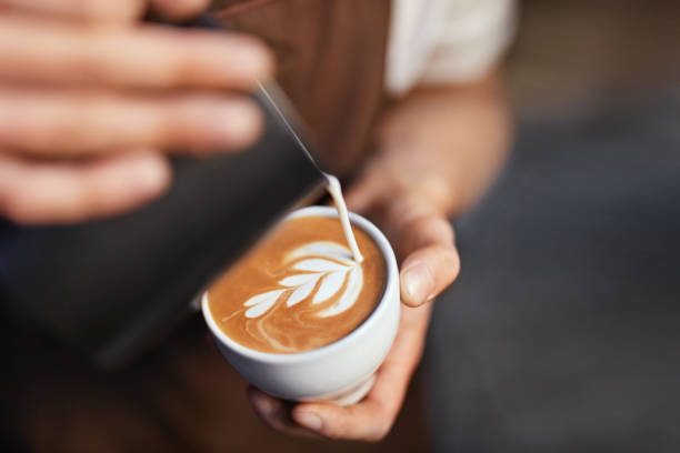 Capuccino con latte art en Kopi Luwak Café